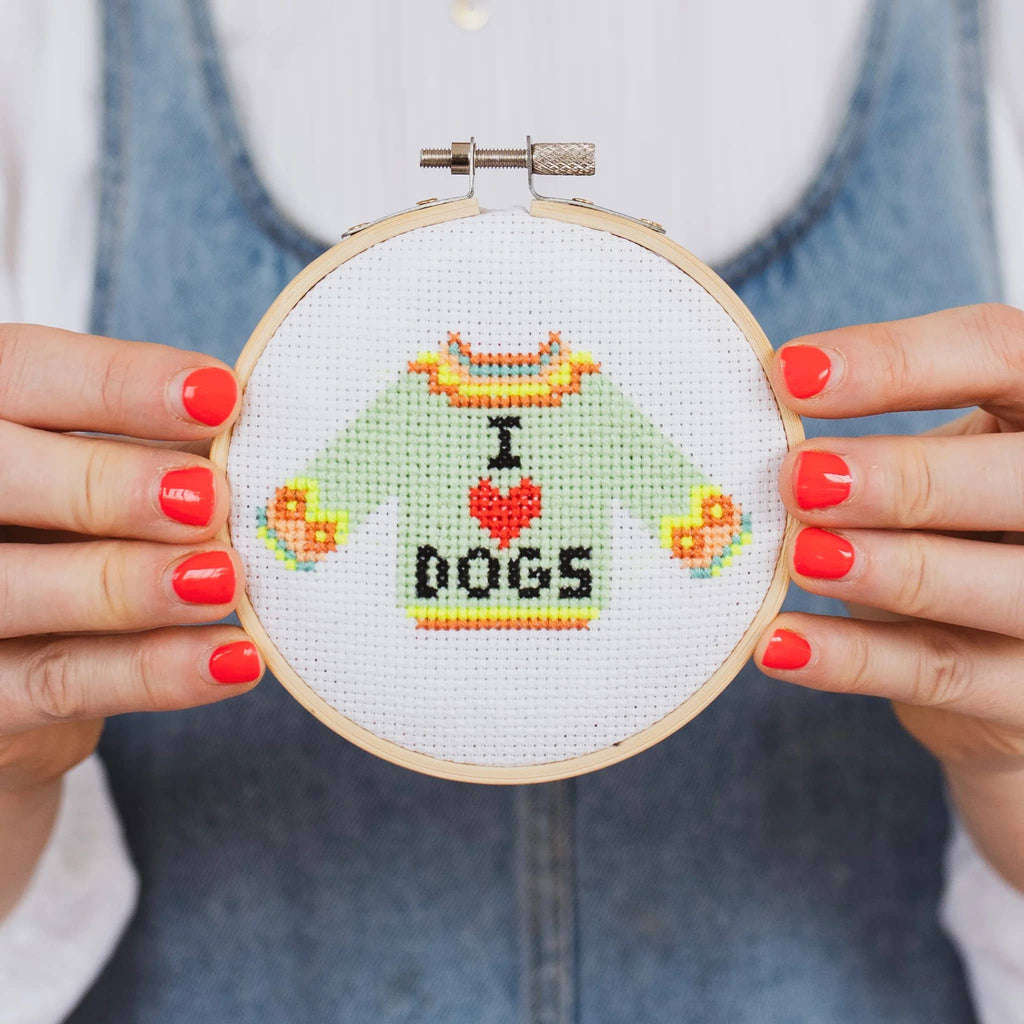 Cotton Clara "I Love Dogs" "mini counted cross stitch kit, finished hoop held by hands.