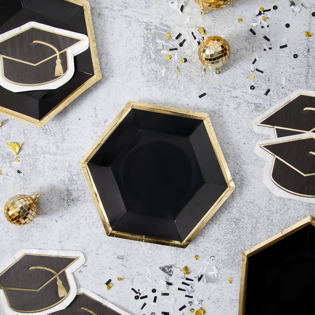 CR Gibson graduation cap shaped paper party napkins with gold detail in a graduation party table setting.