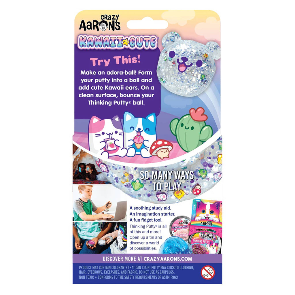 Crazy Aaron's Kawaii Cute clear thinking putty with kawaii-themed clay pieces in tin, in box packaging, back view.