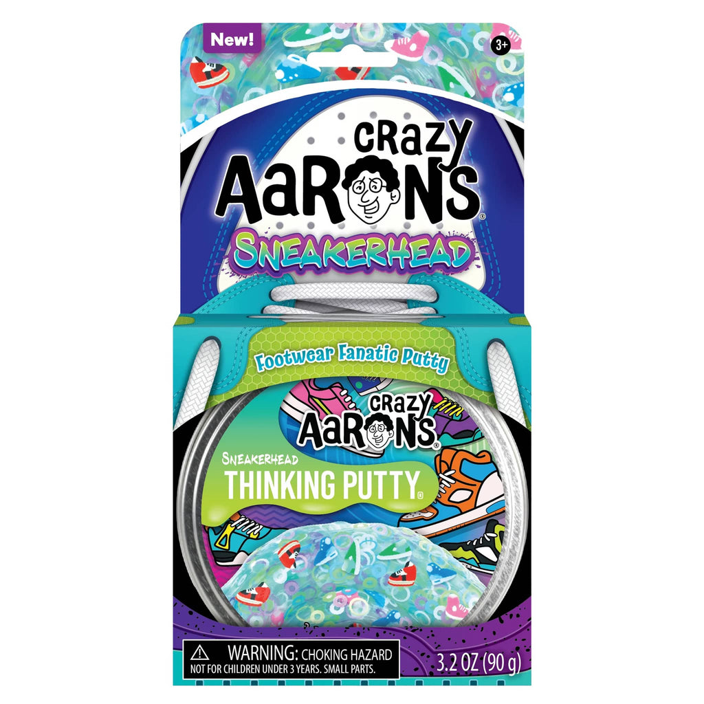 Crazy Aaron's Sneakerhead clear thinking putty with clay sneaker shaped pieces in tin, in box packaging, front view.