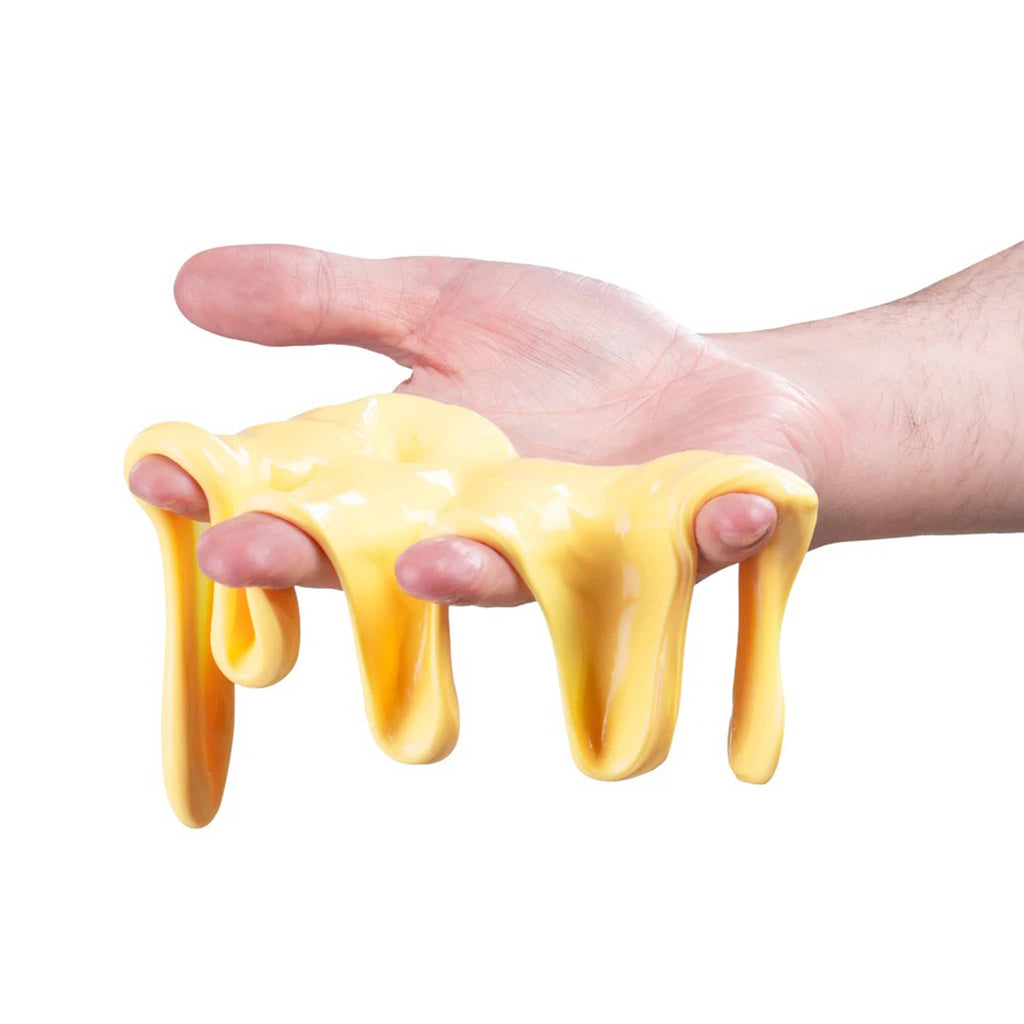 Hand holding oozing yellow slime against a white background.