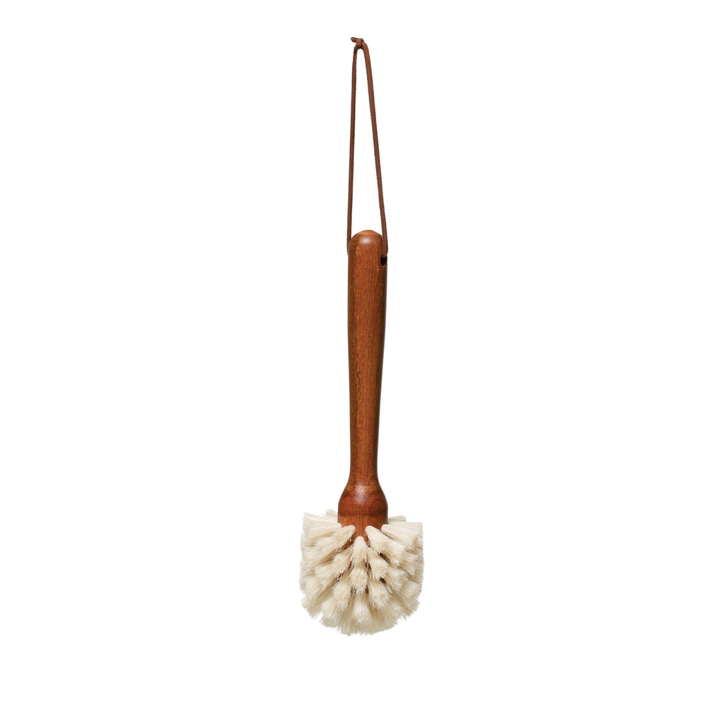 Creative Co-op Beech wood dish brush with leather tie loop for hanging.