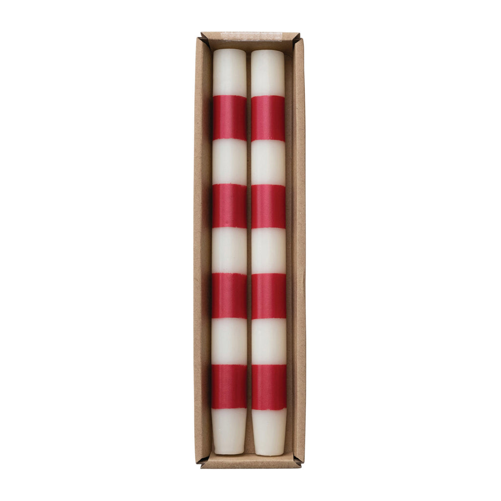 Creative Co-op Red and White Striped Unscented Taper Candles, set of 2 in kraft paper packaging.