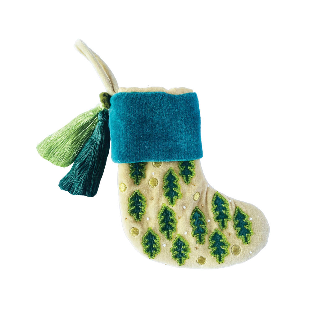 Creative Co-op mini ivory cotton velvet stocking with glass beads, embroidered trees and ornaments and a blue and a green tassel.