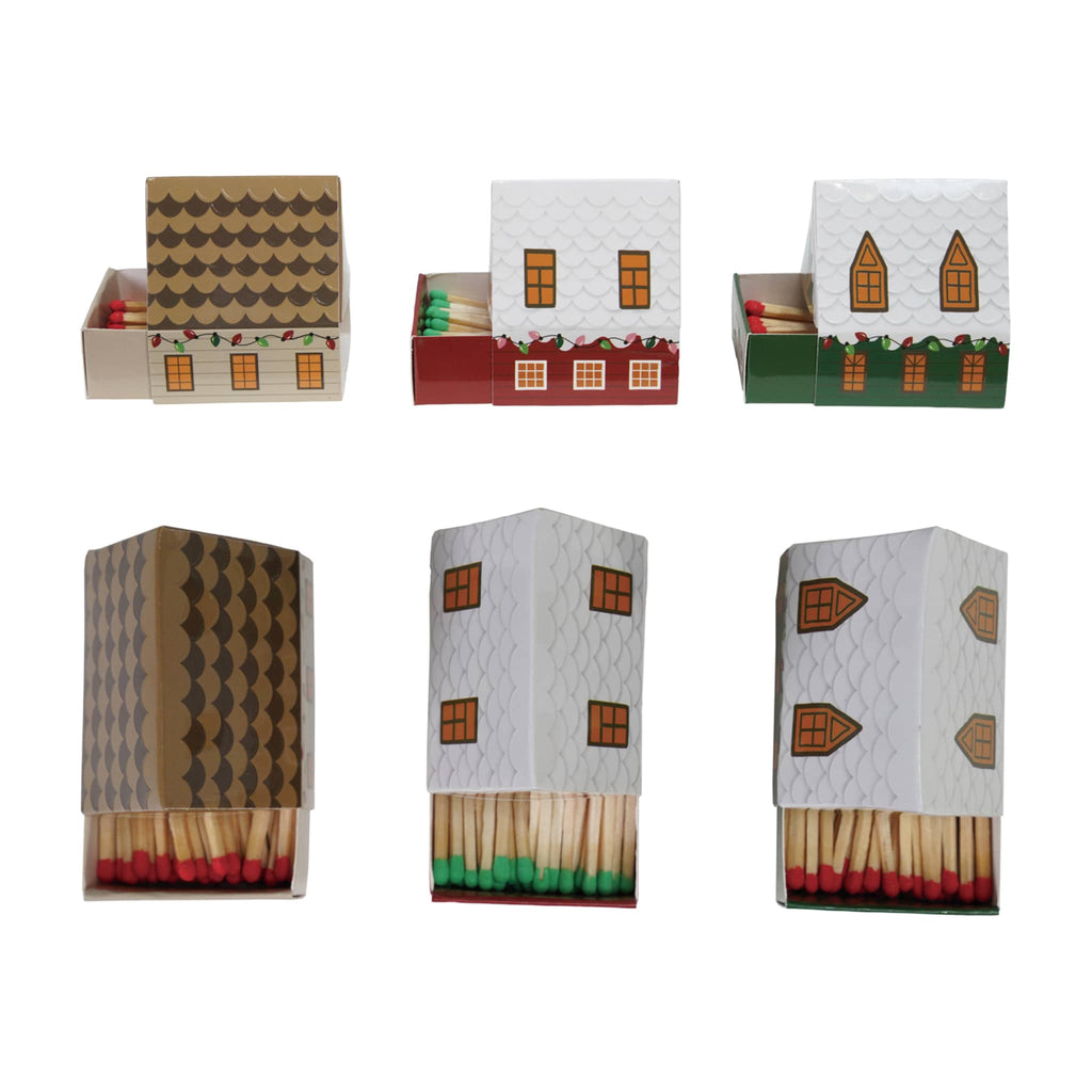 Matches in decorative boxes shaped like houses, side and top view slid open, on a white background.