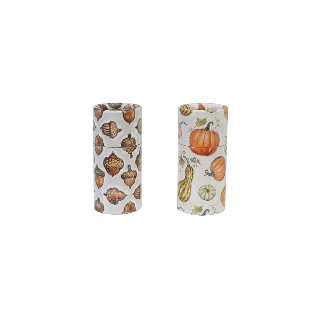 Two cylindrical containers with autumn-themed patterns on a white background.