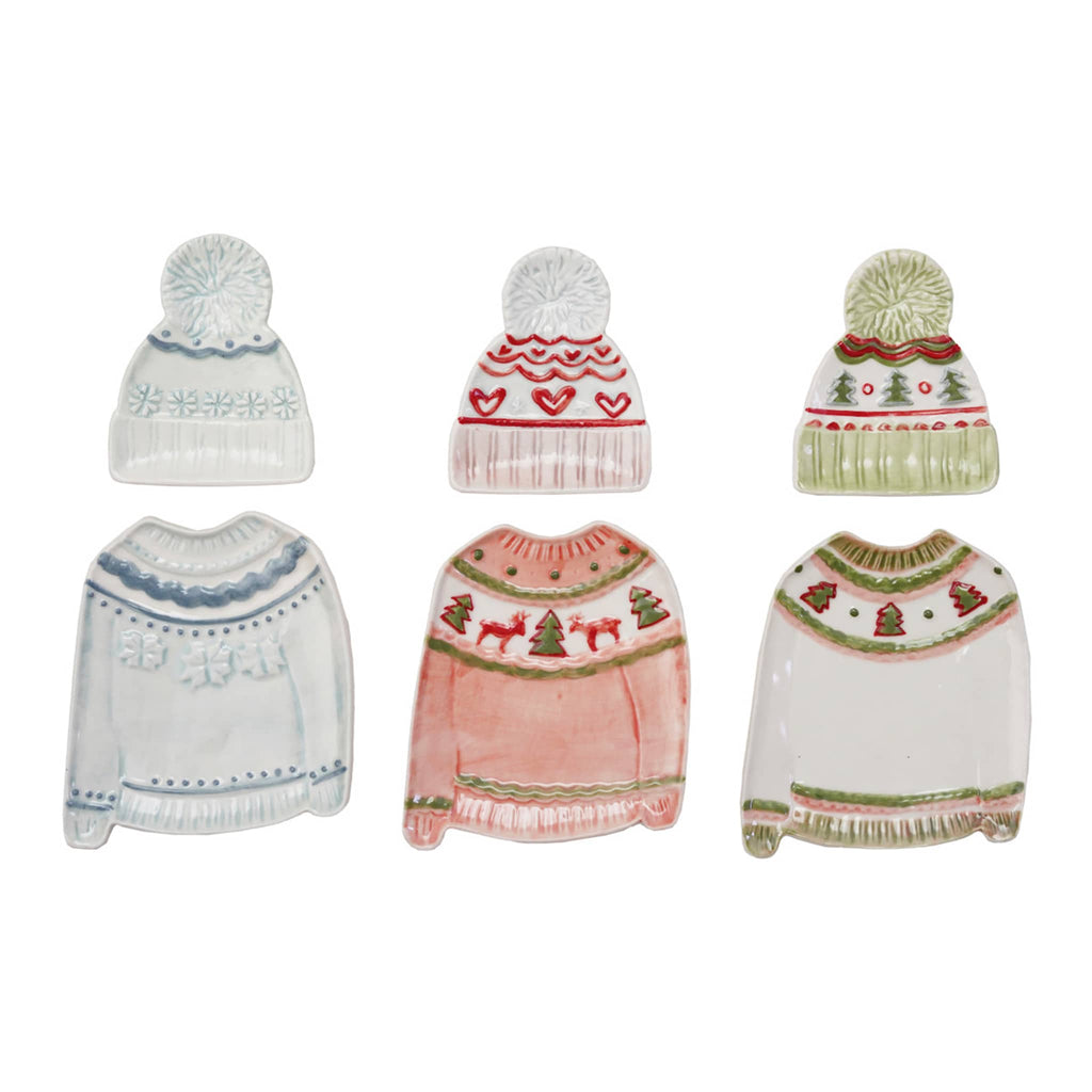 Set of three holiday sweater plates with matching beanie hat dishes, on a white background.