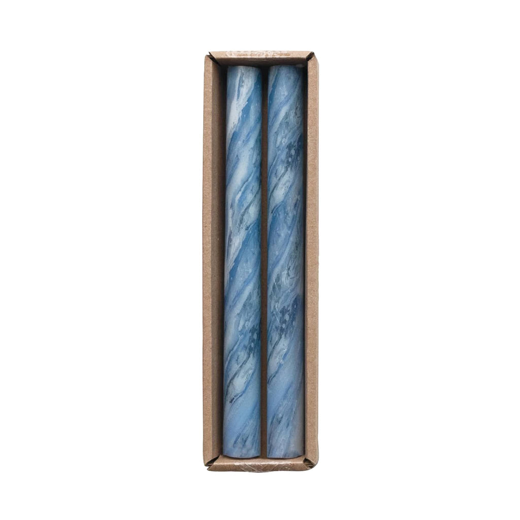 Creative Co-op unscented marbled blue taper candles, set of two in box packaging.