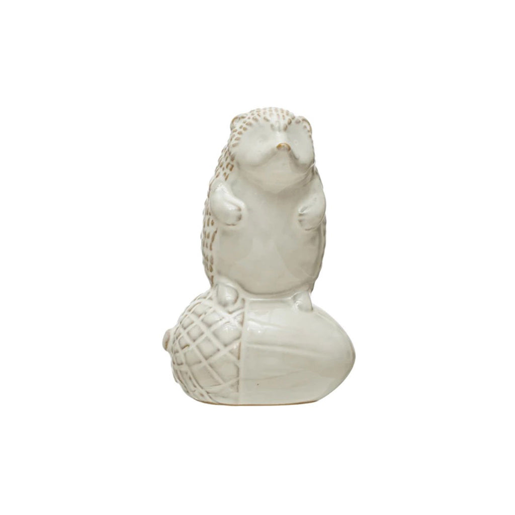 Creative Co-op stoneware hedgehog on an acorn figurine with cream reactive glaze.