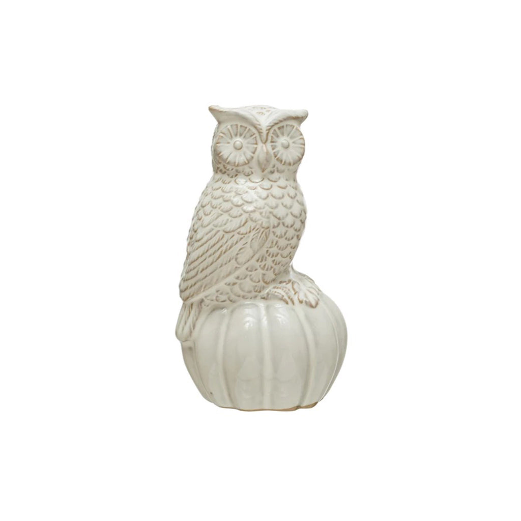 Creative Co-op stoneware owl sitting on a pumpkin figurine with cream reactive glaze.