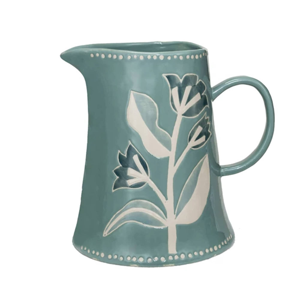 Creative Co-op 2 quart capacity hand-painted blue stoneware serving pitcher with wax relief floral print, front view.