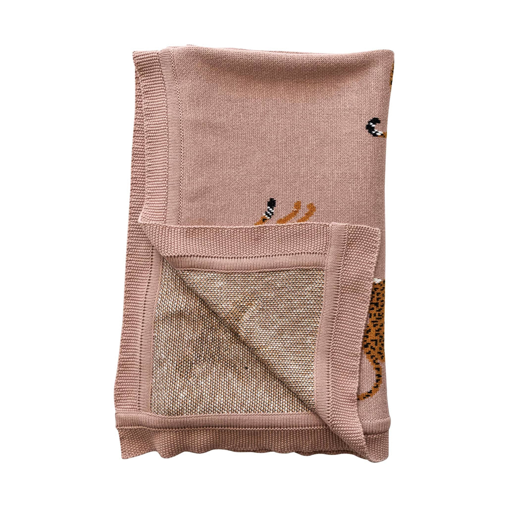 Creative Co-op Cheetah Cotton Knit Baby Blanket, shown folded with corner flipped back to see reverse side.