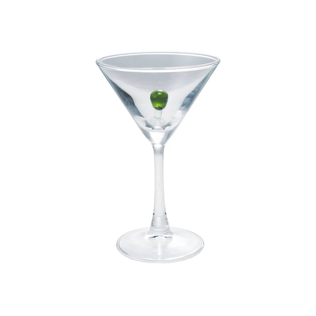 Clear martini glass with a glass green olive inside, on a white background.