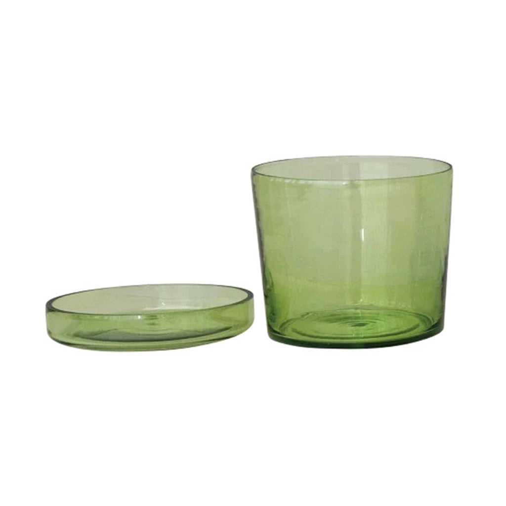 Green glass planter with matching saucer beside it, on a white background.
