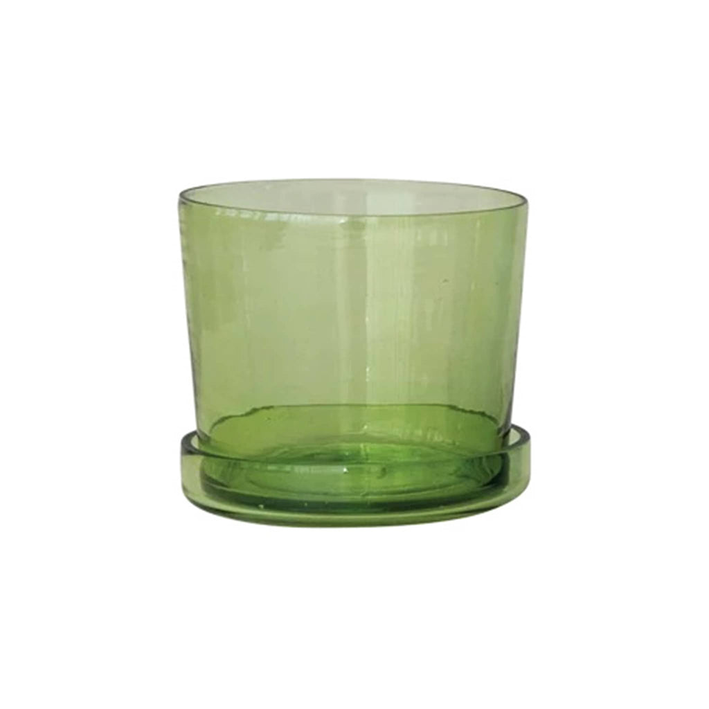 Green glass planter with saucer on a white background.
