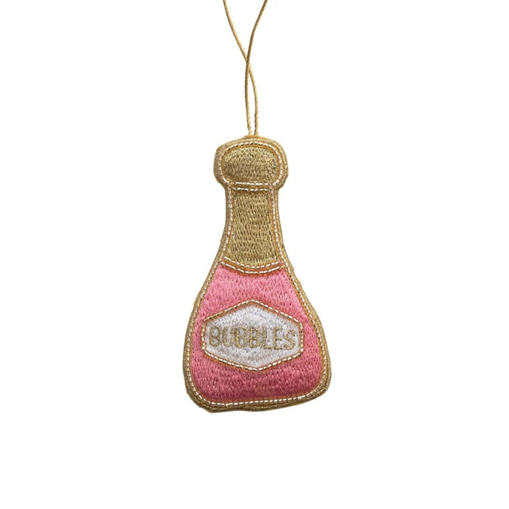 Creative Co-op pink fabric champagne bottle holiday tree ornament with embroidery and beading detail.