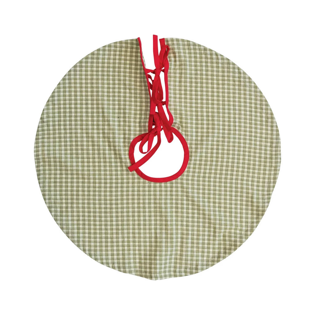 Round green plaid tree skirt with red ties, on a white background.