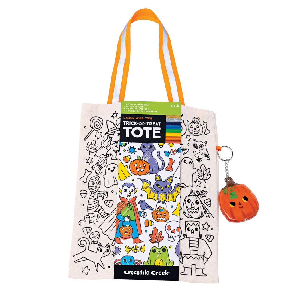 Halloween-themed color in tote bag with belly band packaging and pumpkin keychain on a white background.