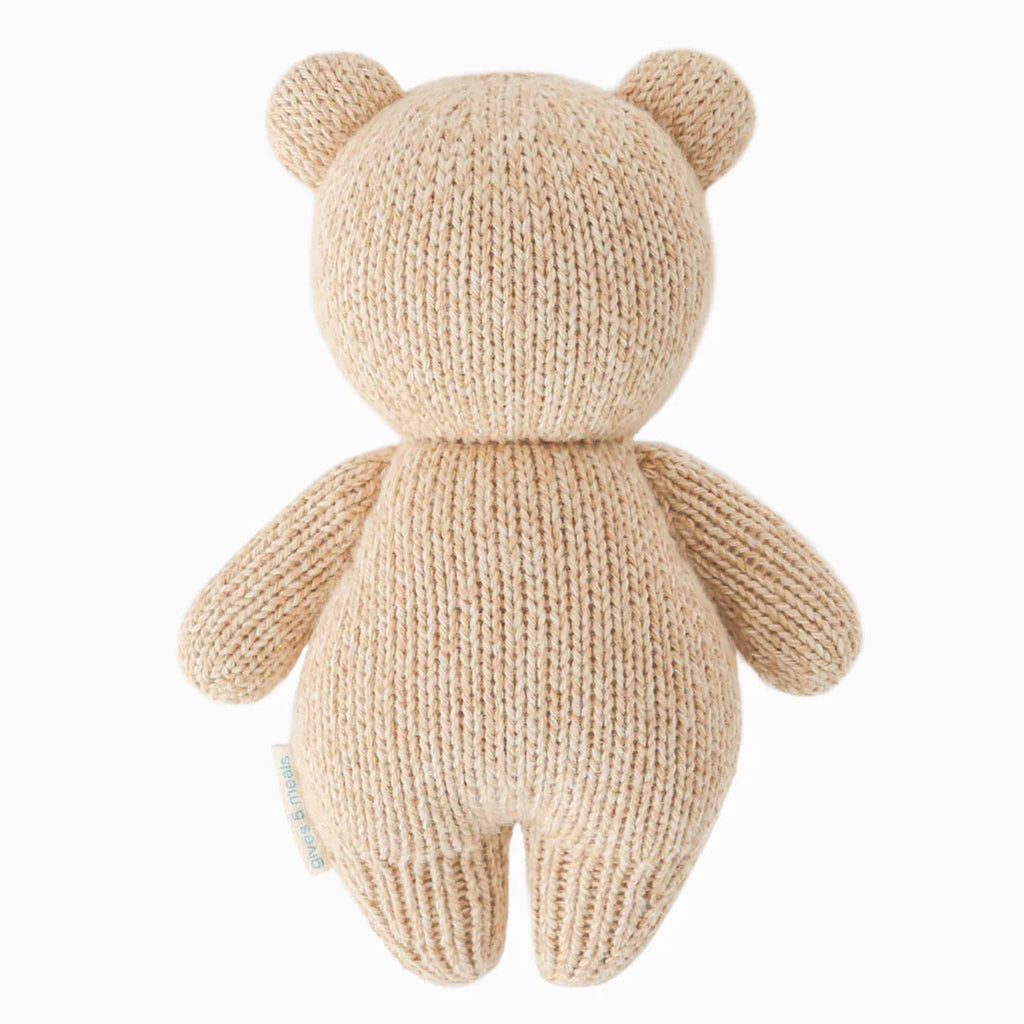 Cuddle and Kind Baby Honey Bear hand knit doll, back view.