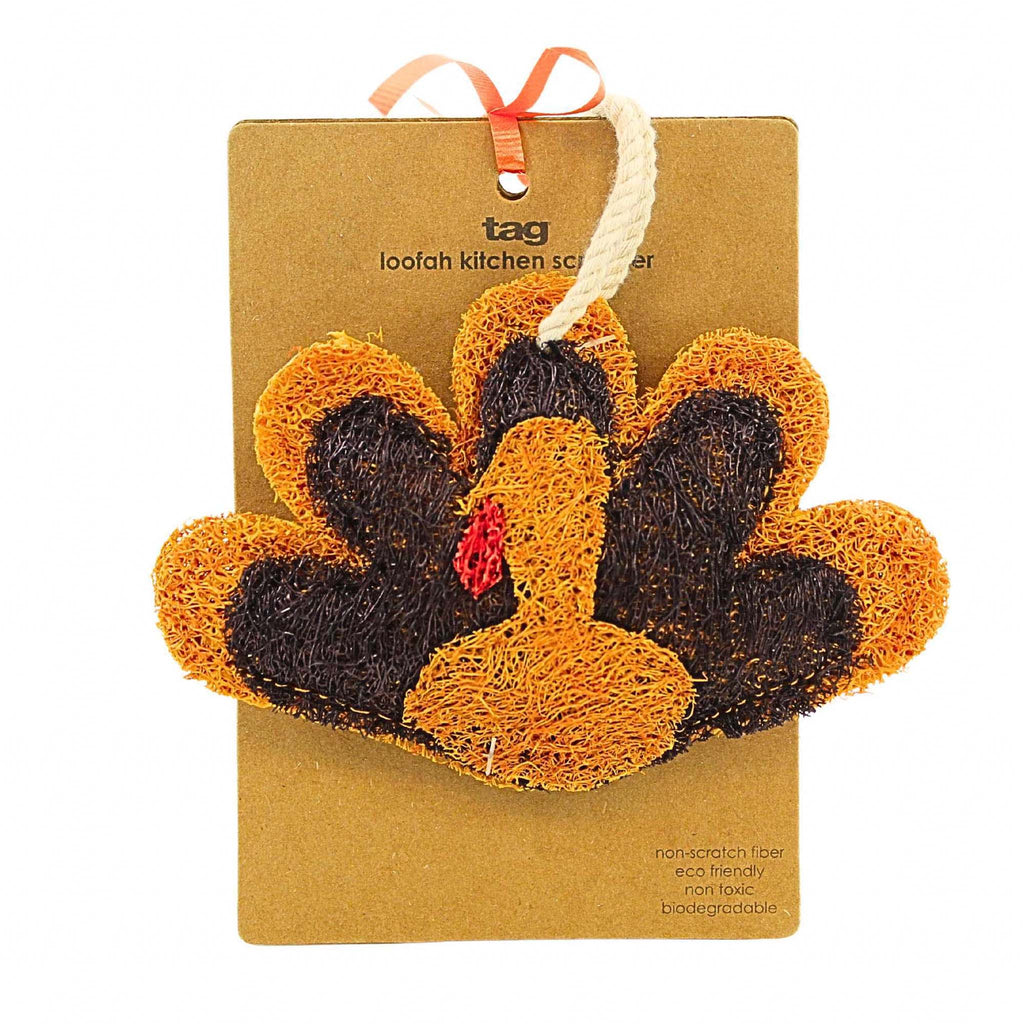 Loofah kitchen sponge shaped like a turkey on a brown card with 'tag' branding.