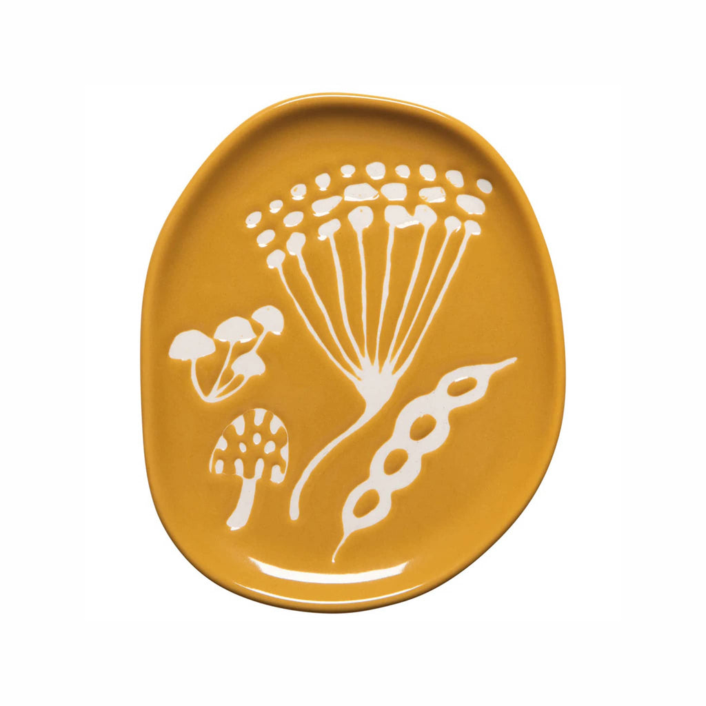 Yellow stoneware trinket tray with white floral and mushroom design, on a white background.