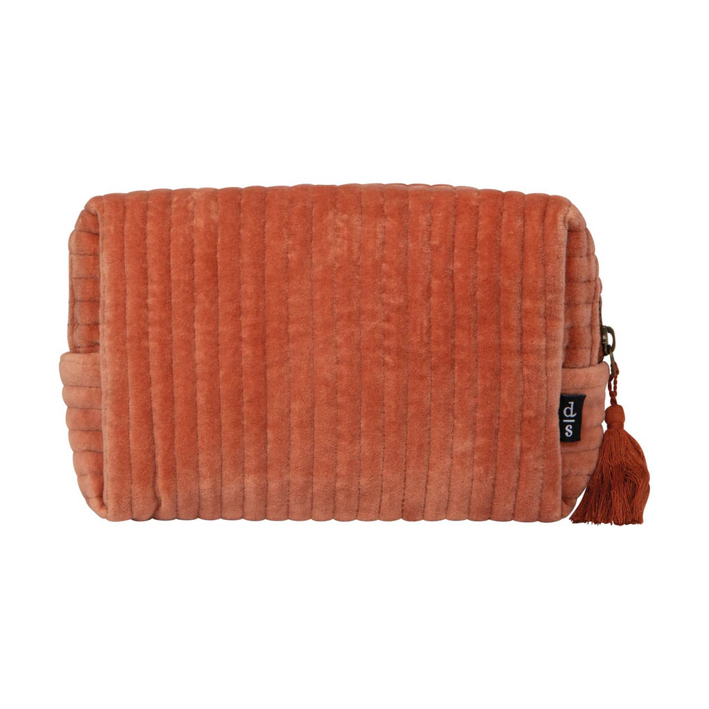 Copper orange color quilted velvet pouch with a tassel, front view, on a white background.