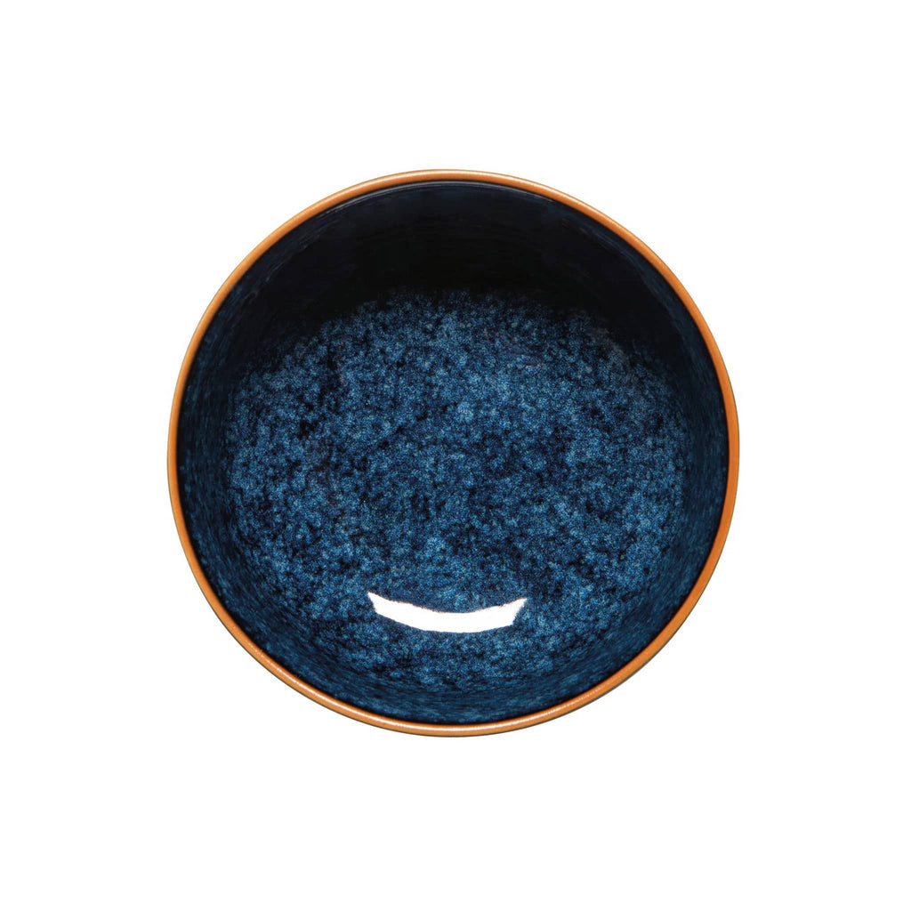 Blue ceramic bowl with brown rim on a white background.