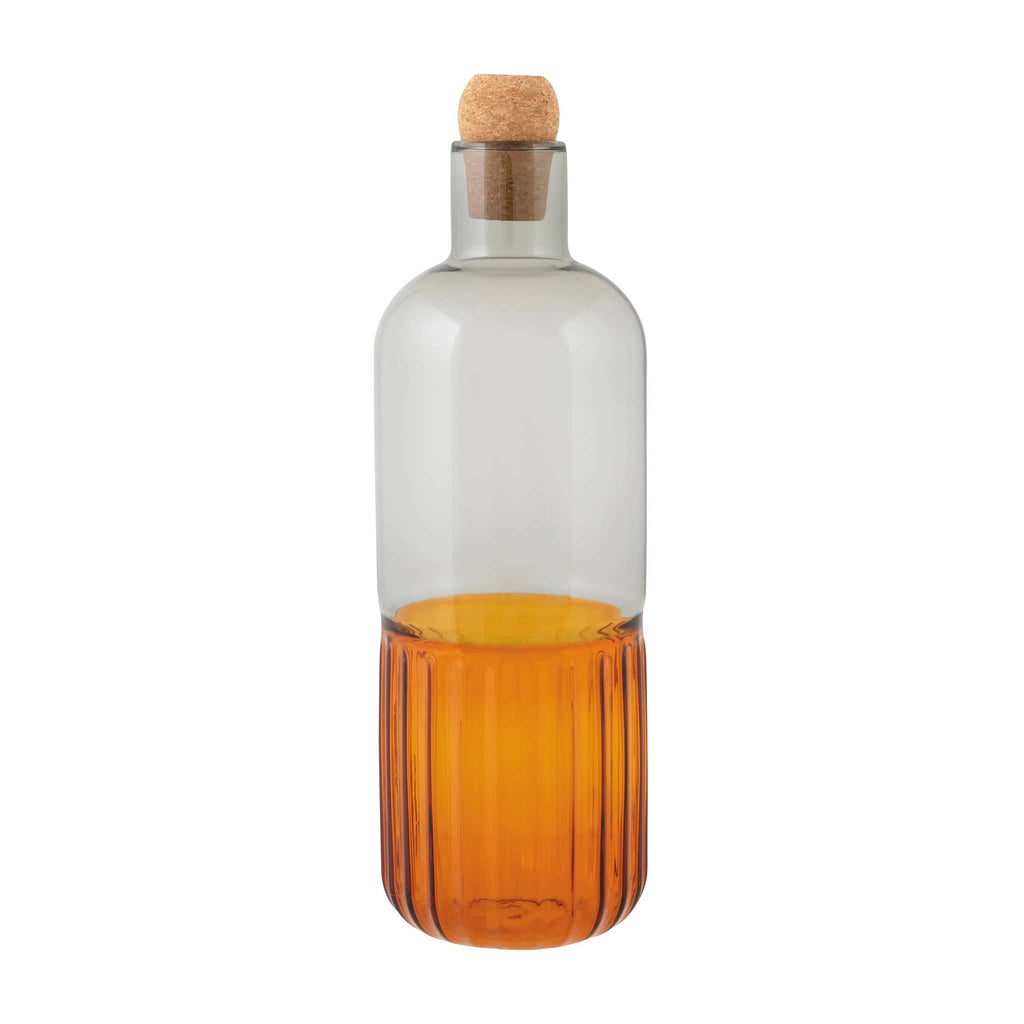 Glass bottle with ribbed amber bottom and smooth smoke gray top with a cork stopper on a white background.