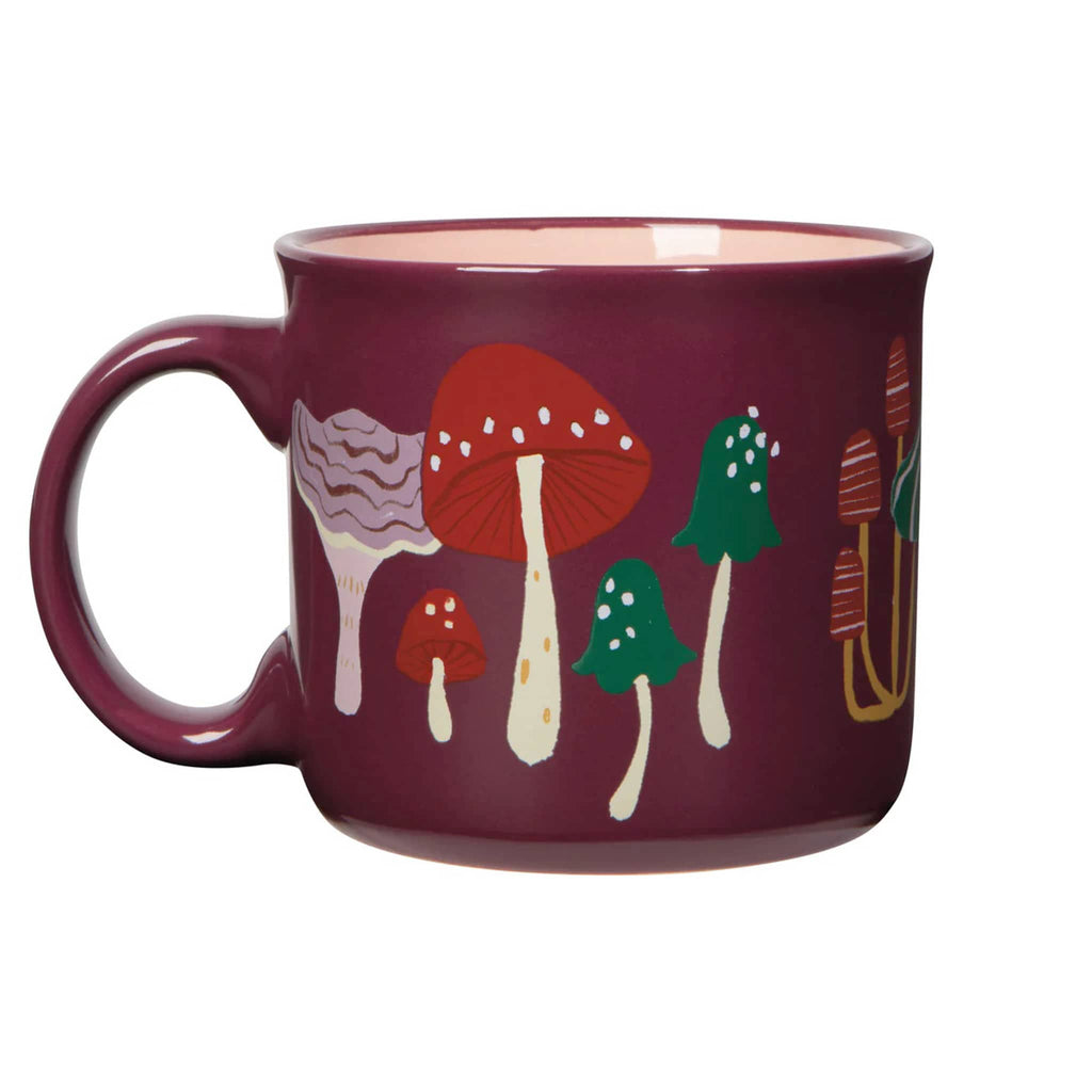 Burgundy mug with colorful mushroom design, handle on left, on a white background.