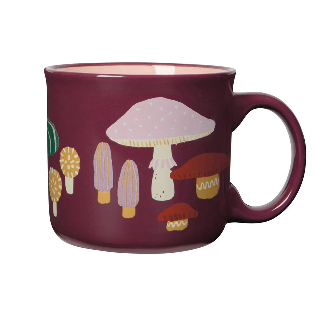 Burgundy mug with colorful mushroom design, handle on right, on a white background.