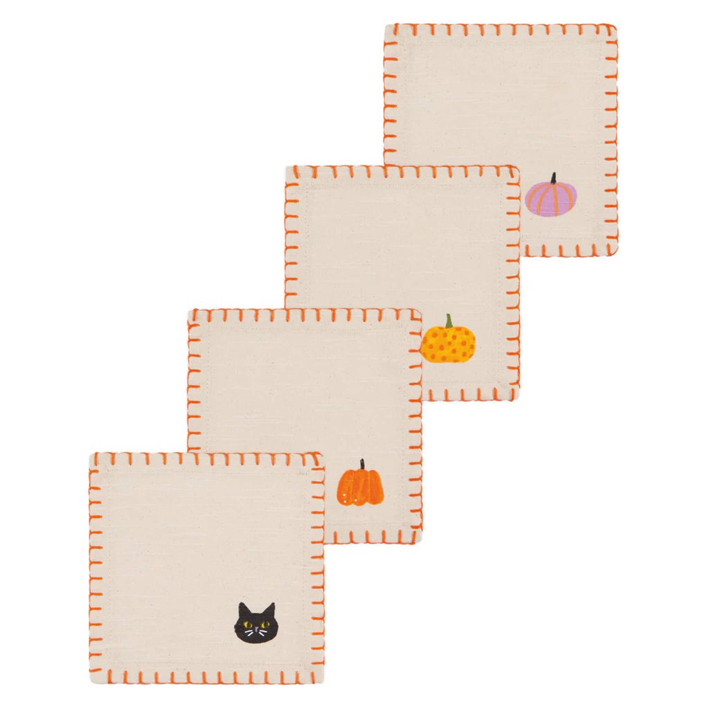 Set of three decorative cotton napkins with pumpkin and cat designs on a white background.