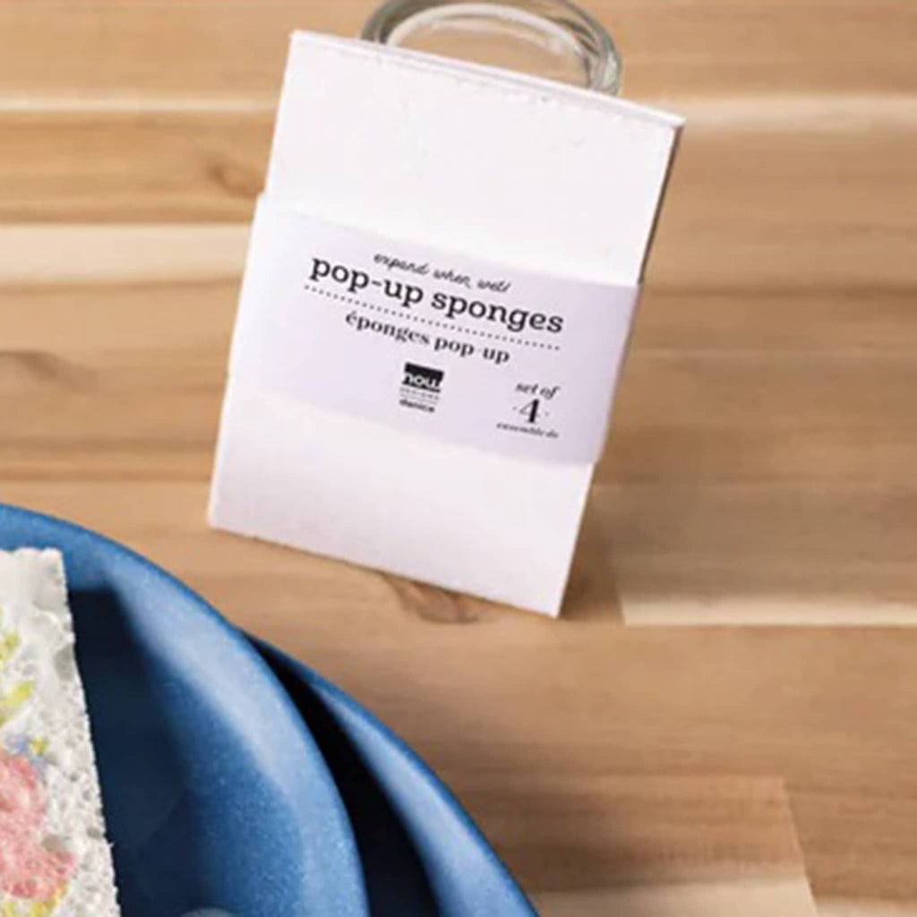 Danica set of four white pop-up cellulose sponges, shown with bellyband packaging.