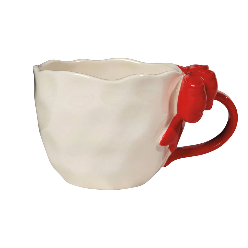 White mug with a red handle on a white background.