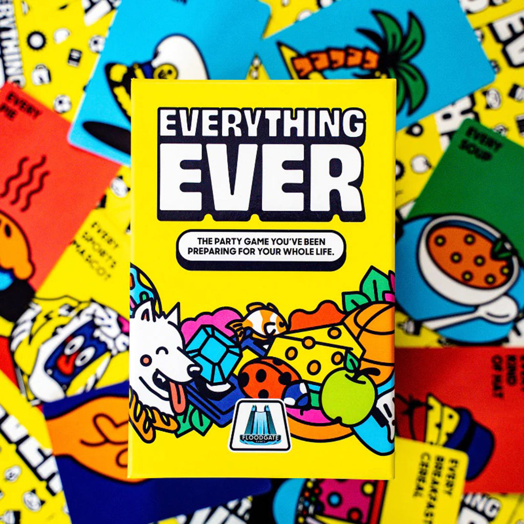 Dara Studios x Floodgate Games Everything Ever: the party game you've been preparing for your whole life, card game in yellow box packaging, front view, box is sitting on a scattered pile of sample cards.