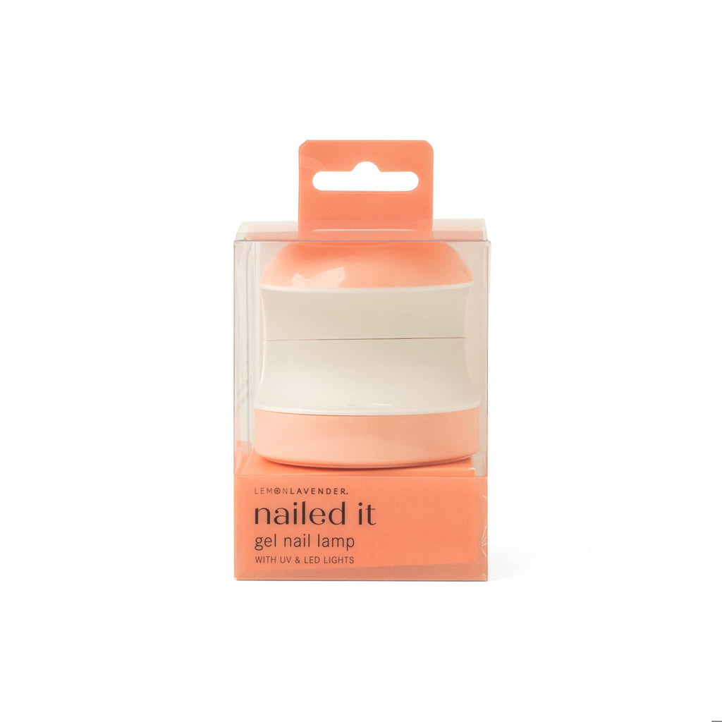 Gel nail lamp in orange packaging with 'nailed it' text on a white background.