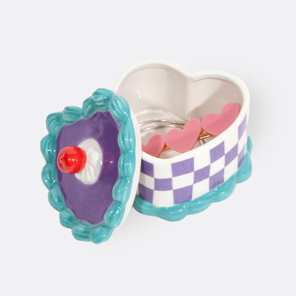 doiy sweetie heart cake shaped ceramic storage box, lid off with jewelry inside.