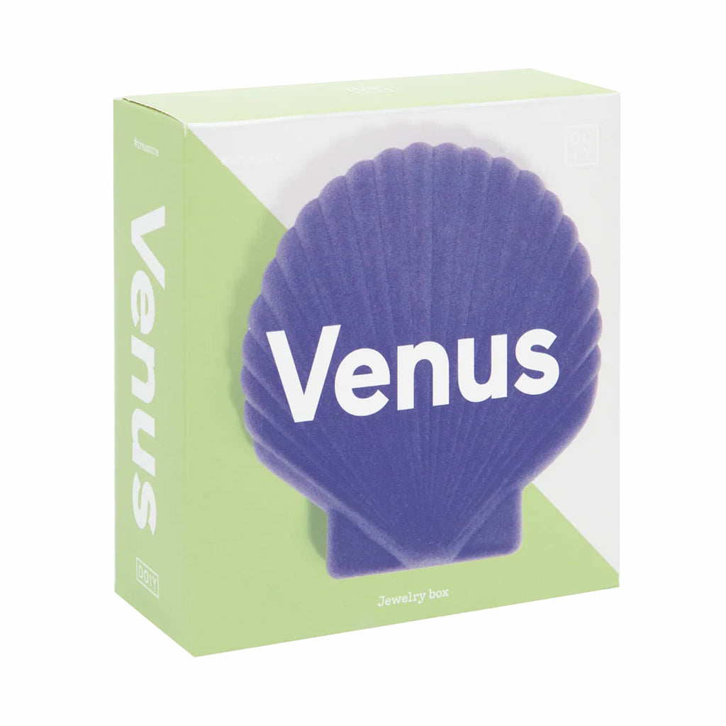 Purple shell-shaped jewelry case in green box packaging on a white background.