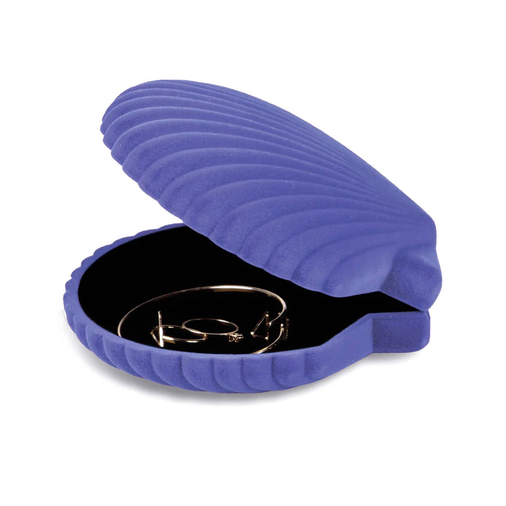 Purple shell-shaped jewelry case with a black interior containing a gold ring on a white background.