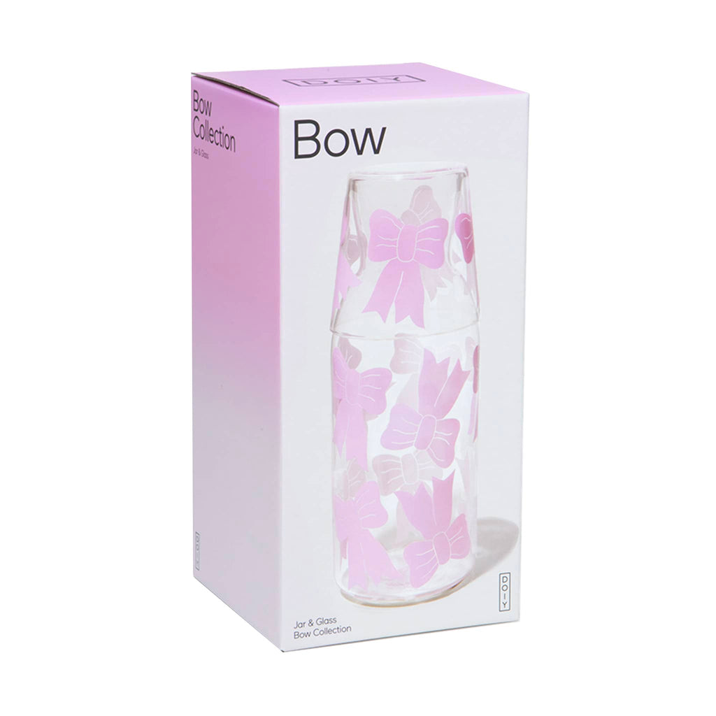 DOIY Bow Carafe and Drinking Glass set, clear glass with pink bows in box packaging.