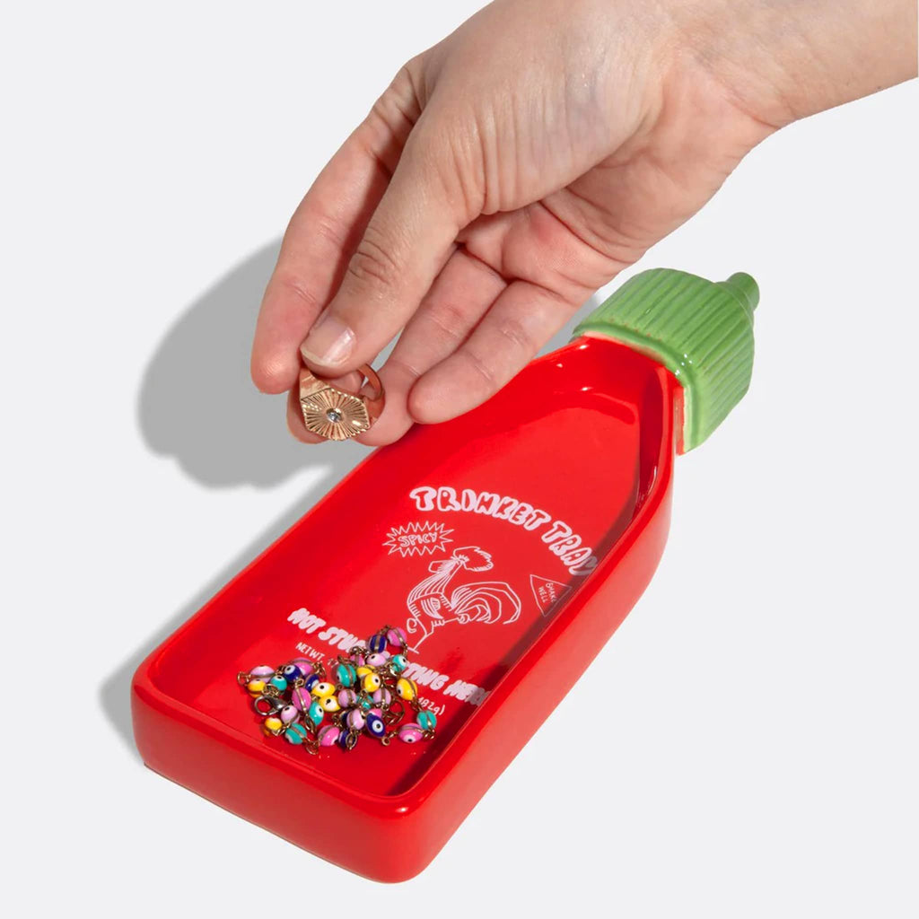 DOIY Corner Shop Collection Sriracha Trinket Tray with hand placing a ring in the tray.