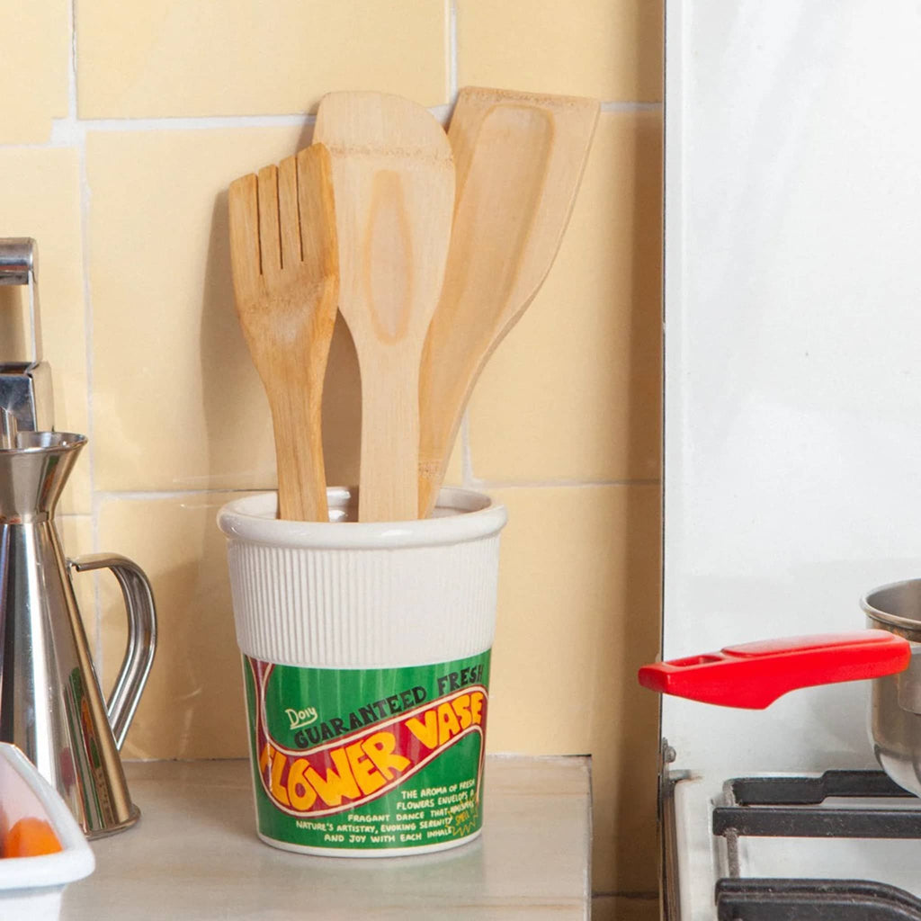 DOIY Corner Shop collection noodles cup vase with wood kitchen utensils on counter.