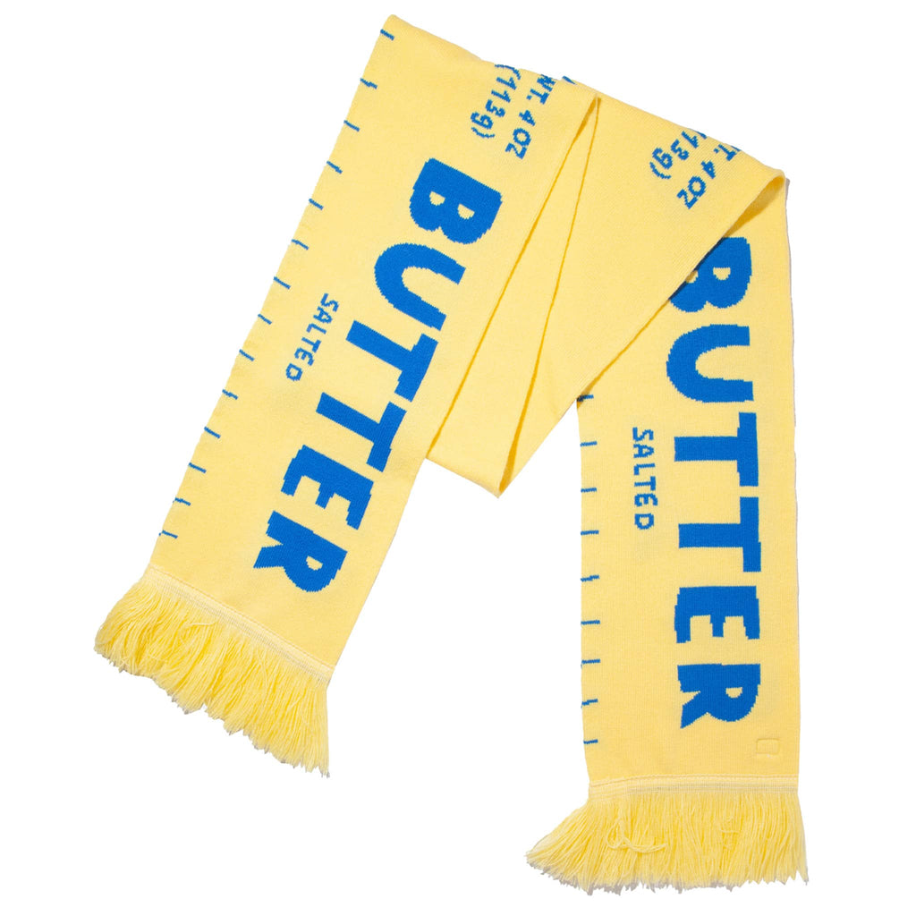 Yellow scarf with blue text 'BUTTER' on a white background.