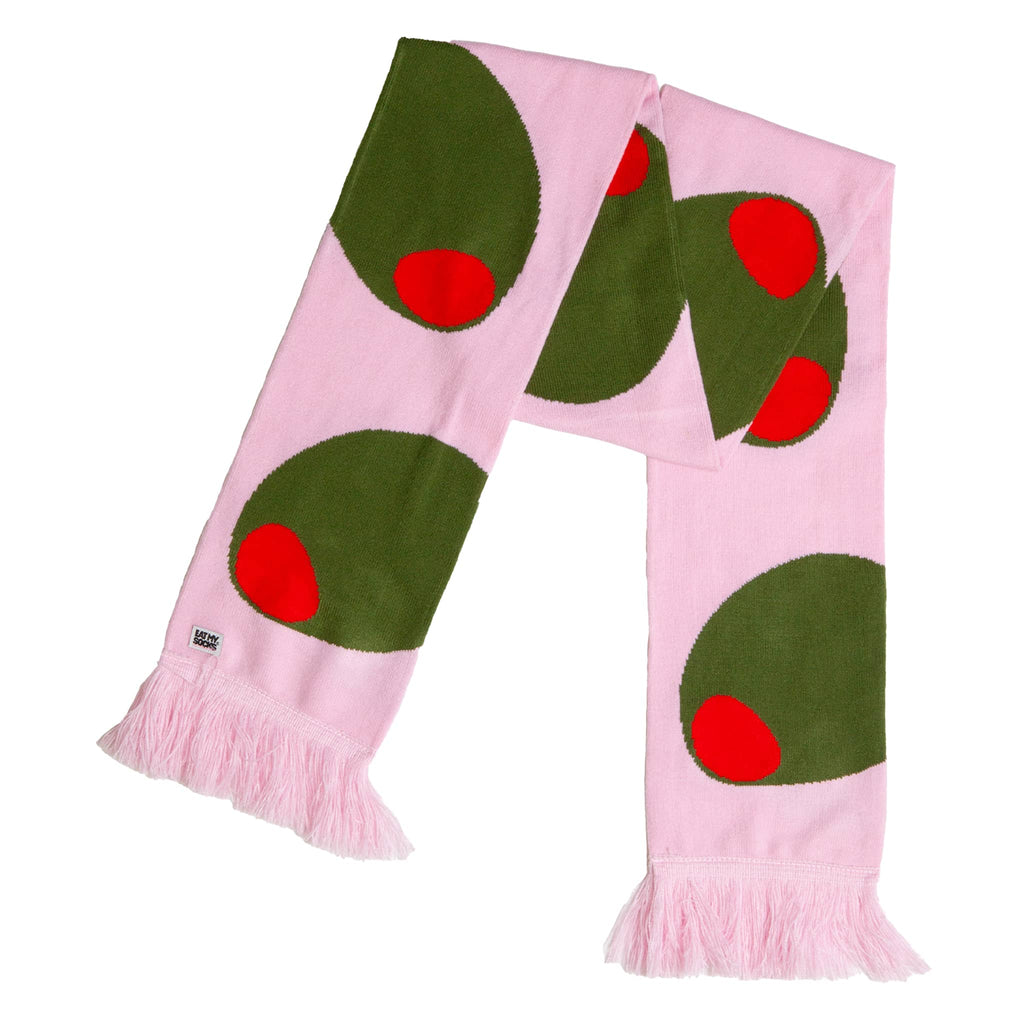 Pink scarf with green olives and red centers on a white background.