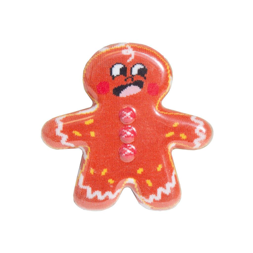 Gingerbread man holiday socks in packaging shaped like a cookie, on a white background.