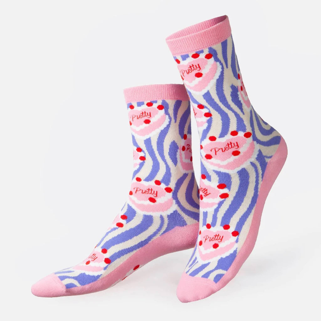 DOIY Eat My Socks pretty cake short crew unisex socks on feet forms.