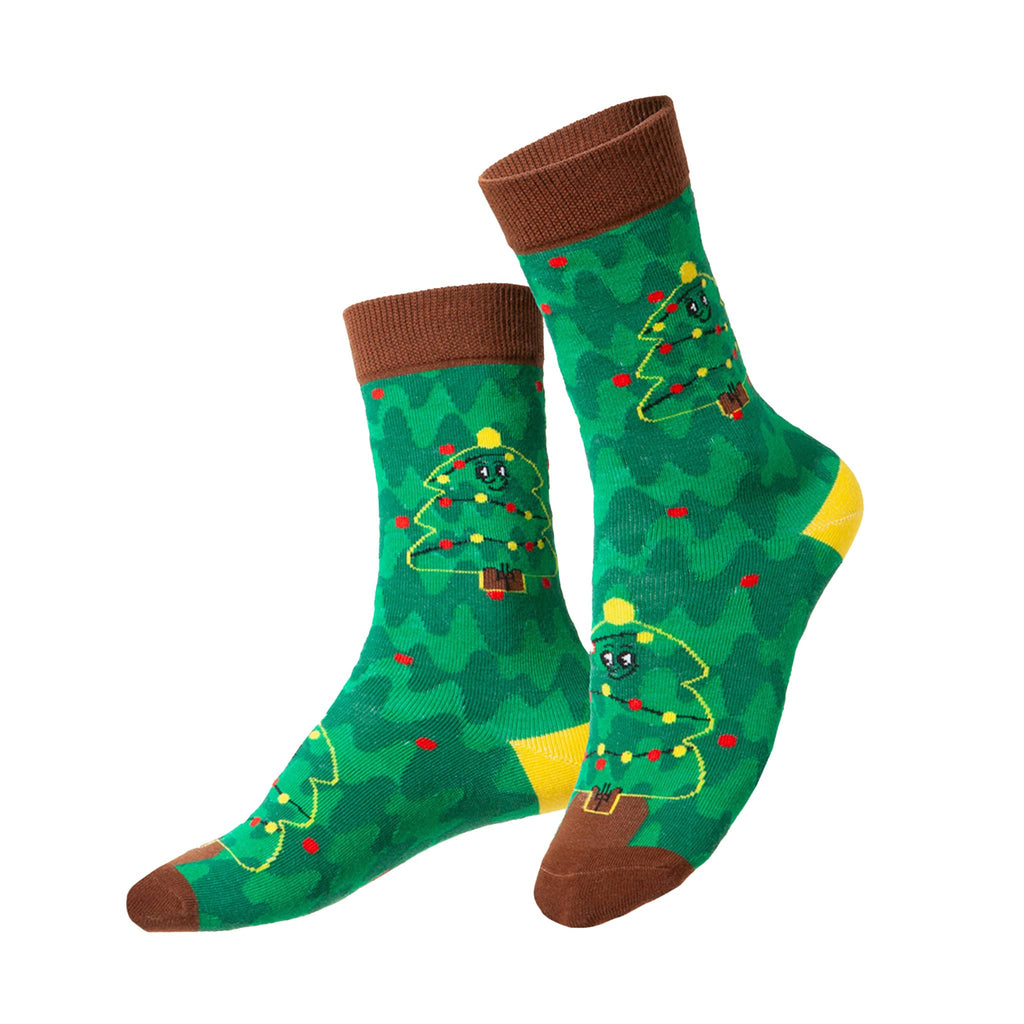 Green kids crew socks with Christmas tree design on a white background.