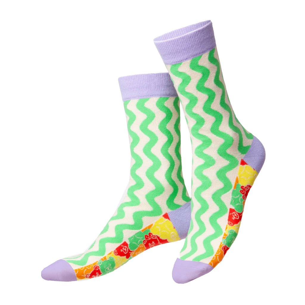 Colorful socks with green zigzag pattern and purple accents on a white background.