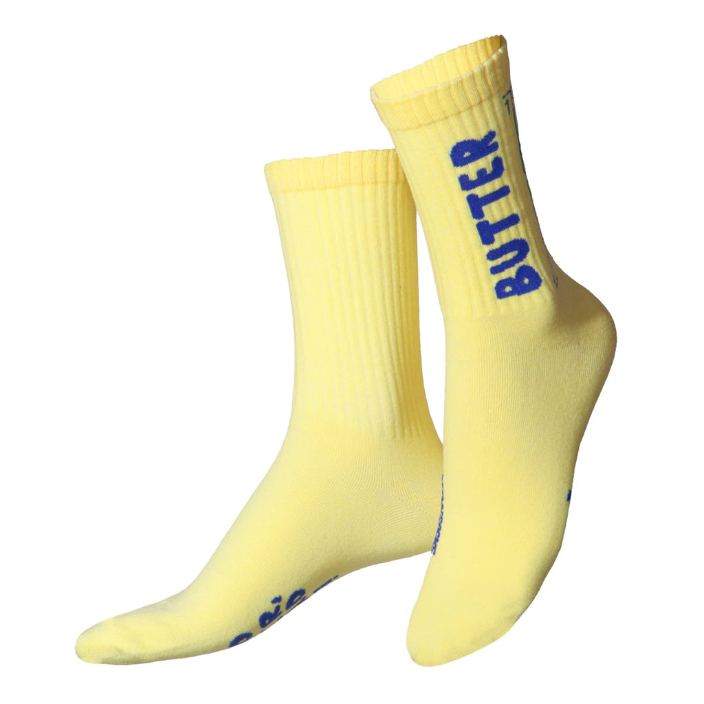 Yellow socks with blue text on a white background.