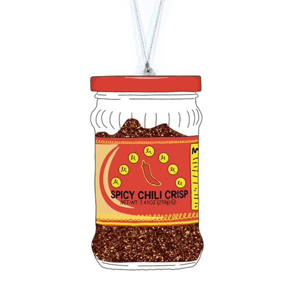 Decorative acrylic ornament shaped like a jar of 'Spicy Chili Crisp' with a red lid on a white background.
