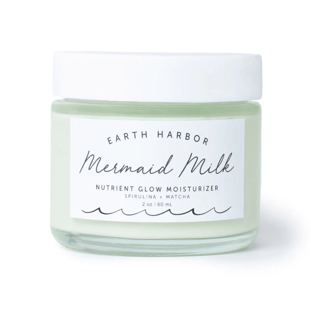 Earth Harbor Mermaid Milk Nutrient Glow Moisturizer with Spirulina and Matcha in glass jar, front view.